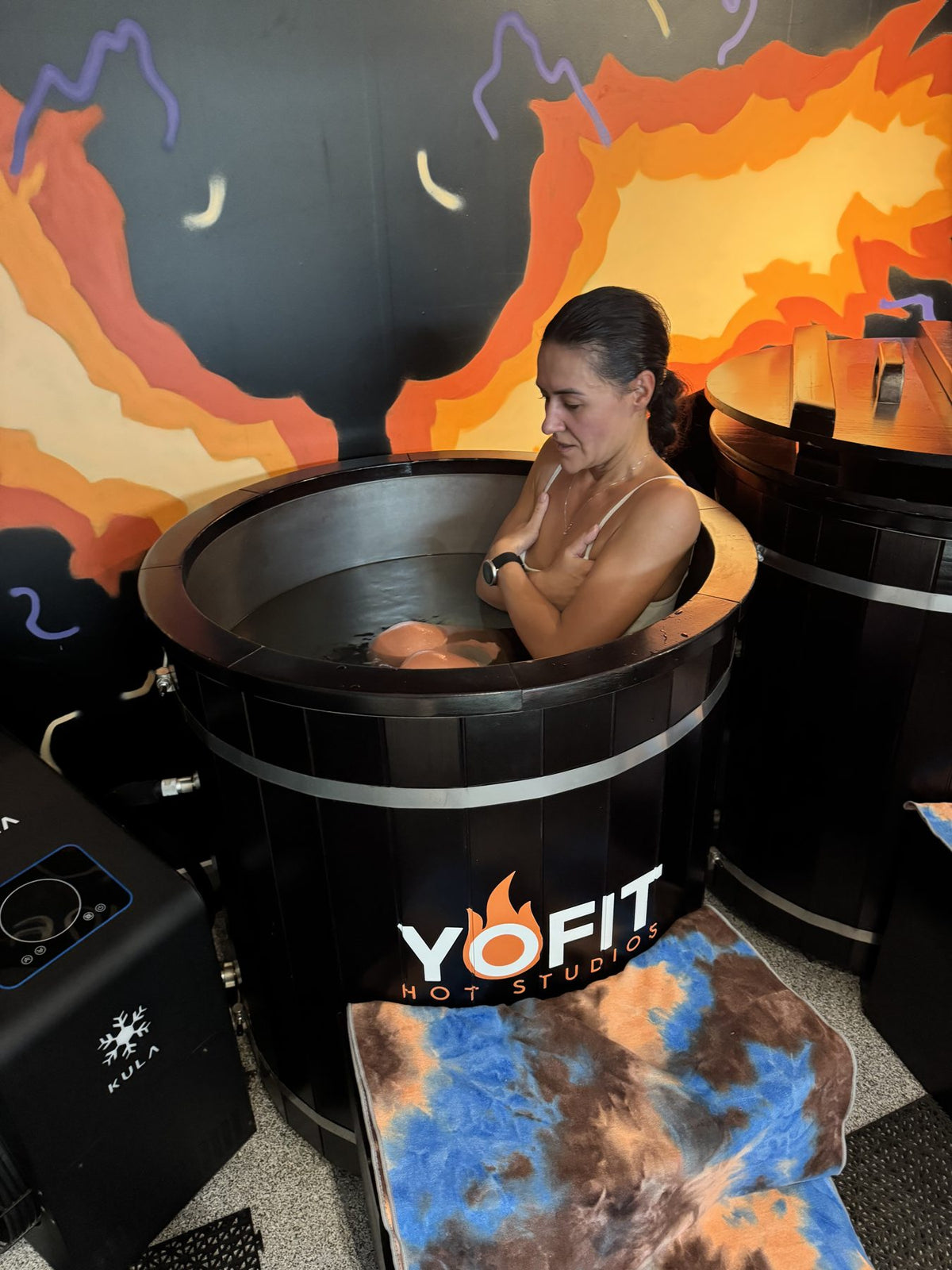 Member using a YOFIT branded KULA cold plunge at YOFIT DIFC, Dubai
