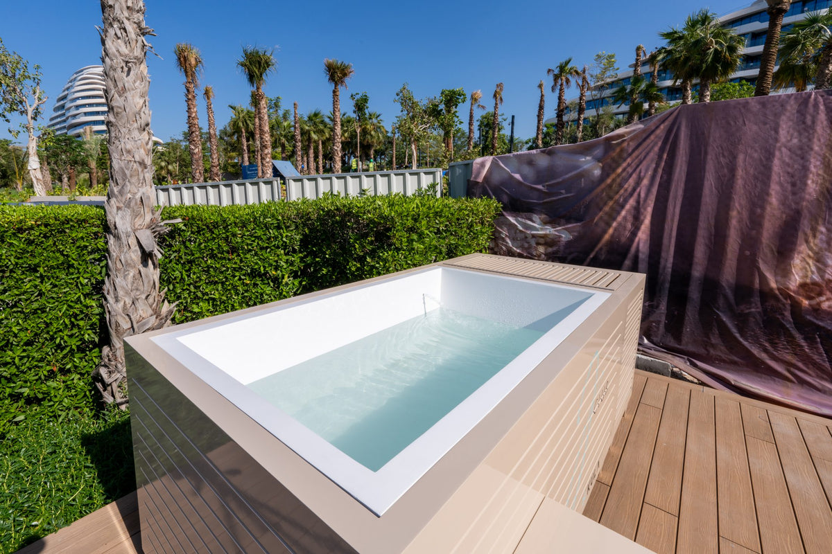 Bespoke KULA outdoor ice bath at J Club, Jumeirah Beach Hotel, with the Burj Al Arab behind