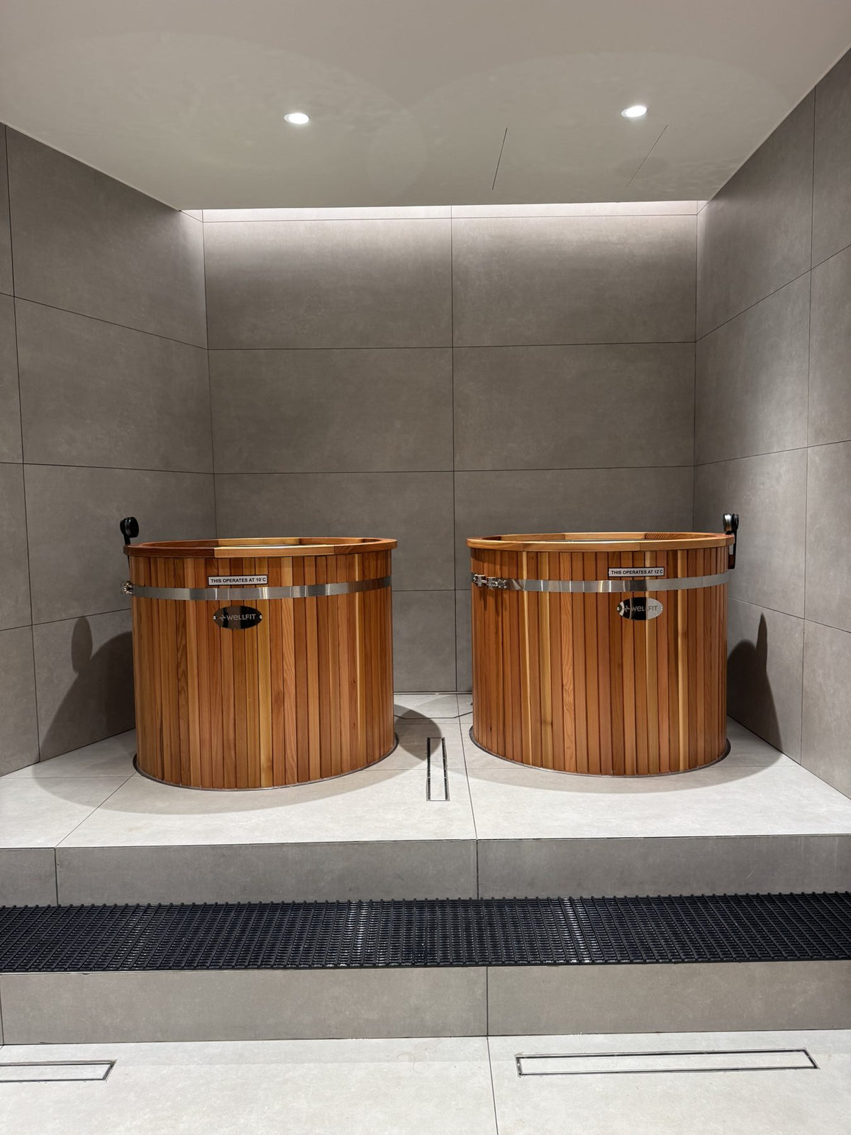 Two KULA red cedar barrel cold plunges in the Wellfit JVC recovery room, Dubai