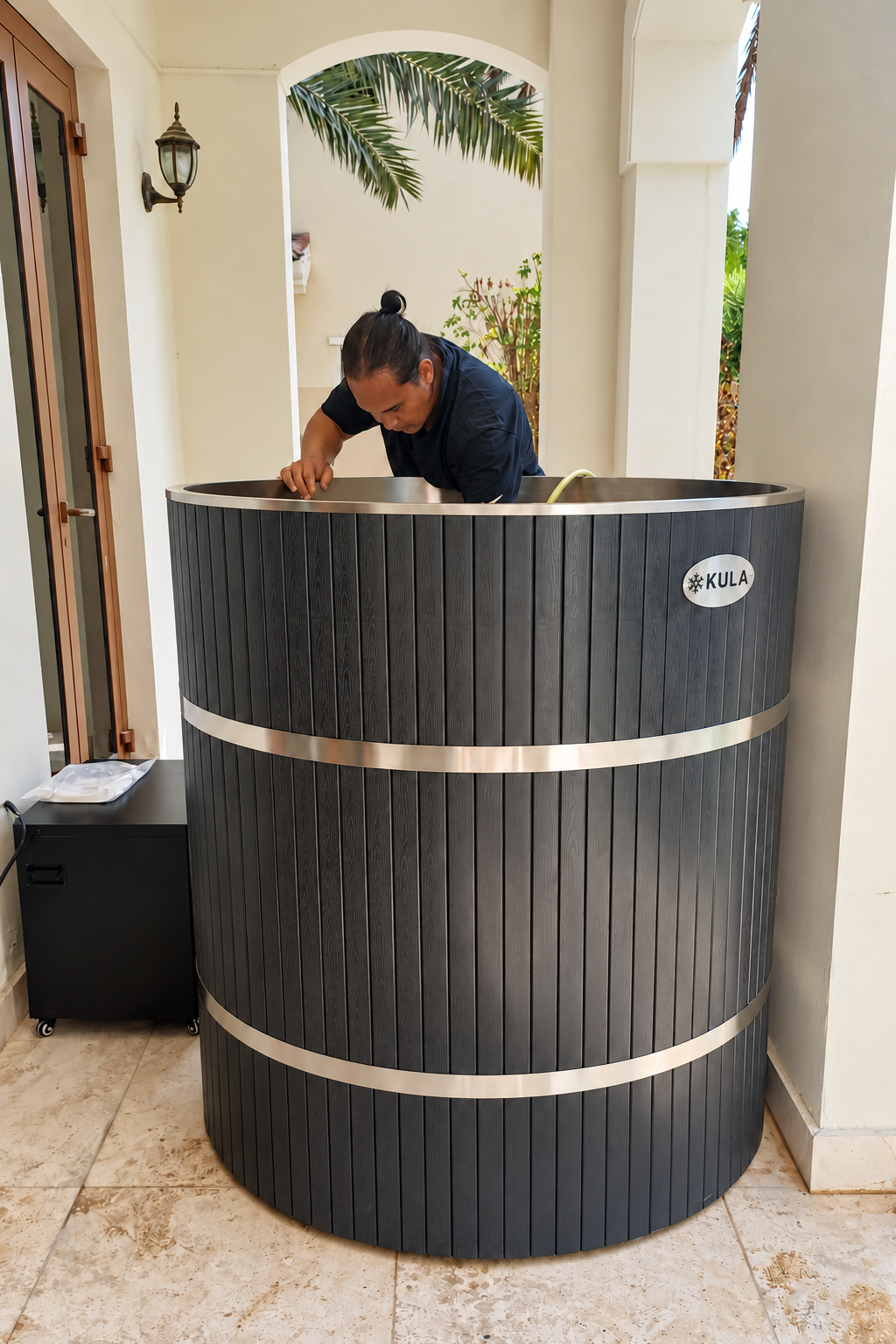 KULA technician servicing a KULA cold plunge at a villa in Dubai